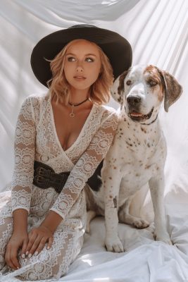 Cute dog posing with blonde lady